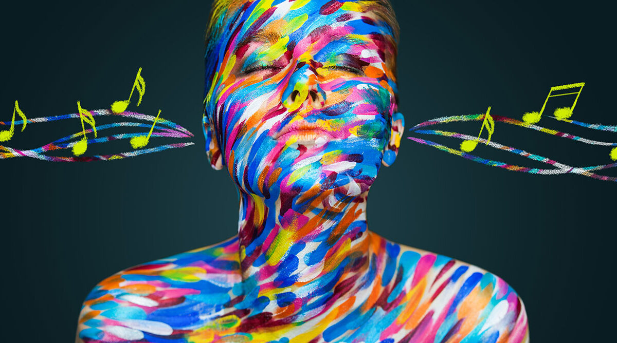 illustration of person with rainbow projected on their head & shoulders