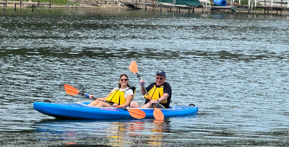 Stacy and Todd kayaking on the river Stacy and Todd kayaking on the river