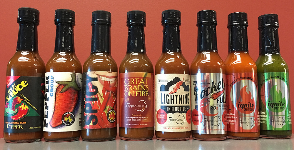 The Pepper Group hot sauce bottles with custom labels