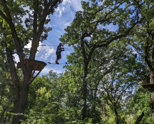 Brian on a rope course Brian on a rope course