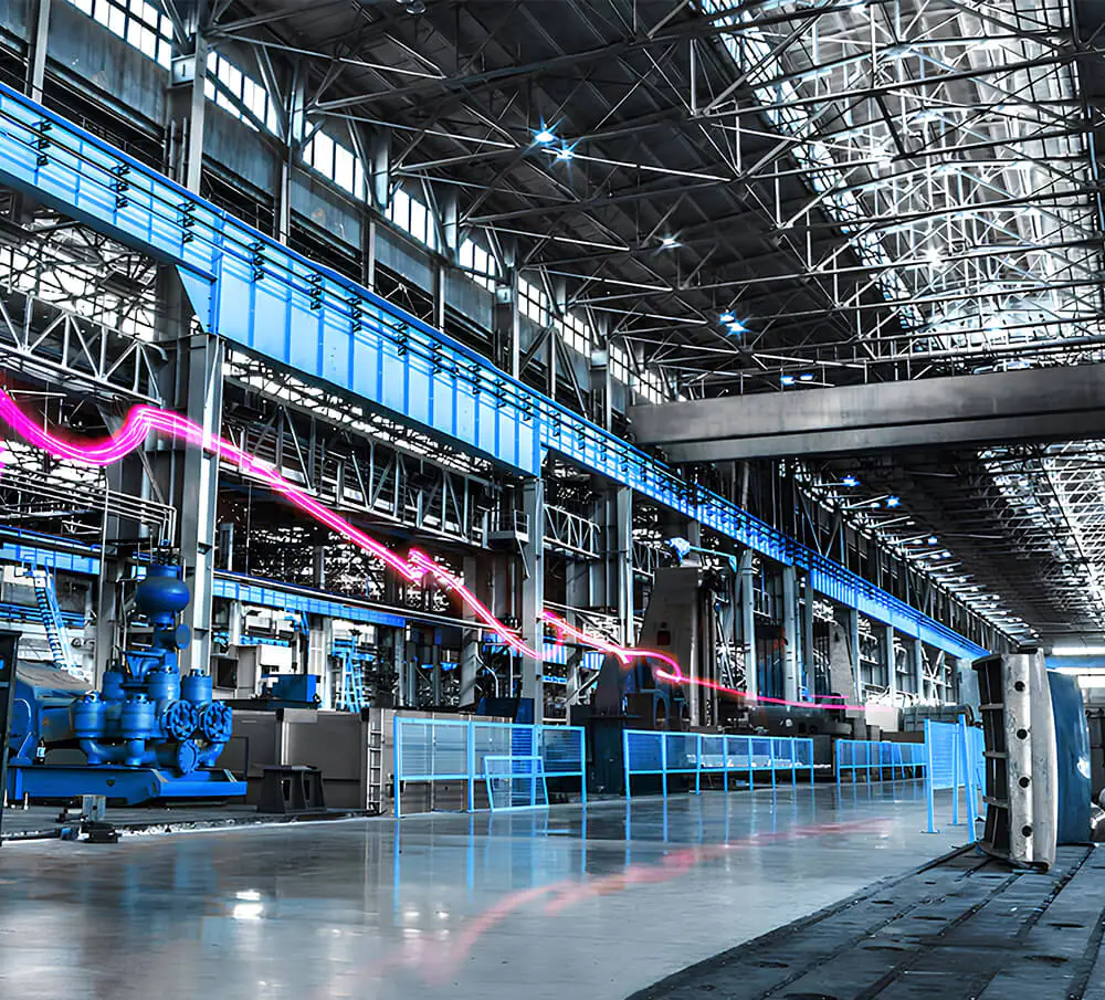 Ribbon of light showing movement through an industrial manufacturing facility