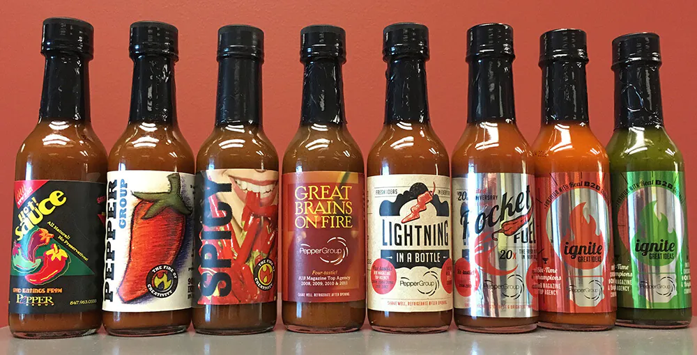 The Pepper Group hot sauce bottles with custom labels